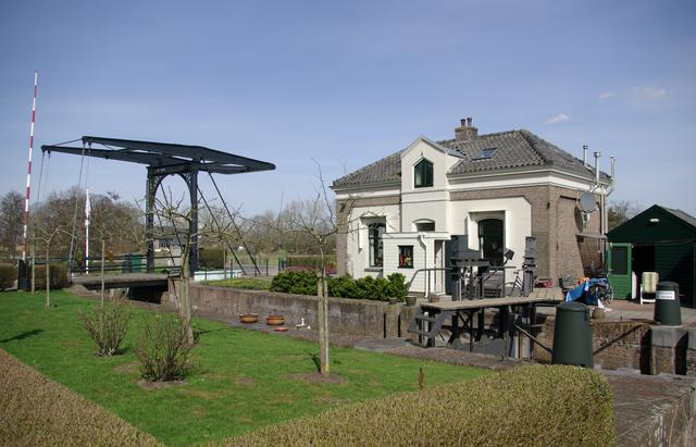 The charming little lock with a drawbridge and a historic operator's house over the Gravelandsevaart in Weesp