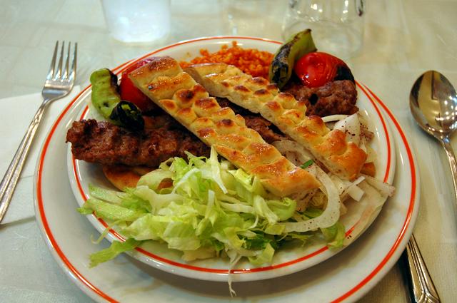 Adana kebap, a skewer of minced meat spiced with chili and topped with pide bread, a speciality of Adana