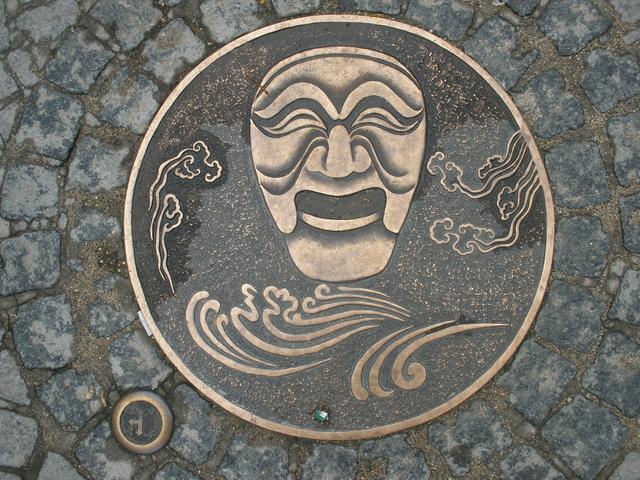 Manhole cover showcasing the most iconic mask of Andong.