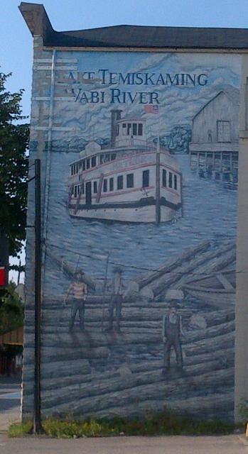 The mural commemorating travel and logging on the Wabi River - just south of the river on Armstrong Street, New Liskeard.