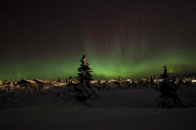 Aurora Borealis (northern lights) above Trysil ski lodges