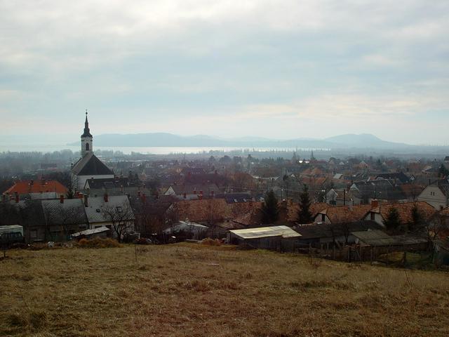 A panorama of the city, the lake, and the hills beyond the far shore