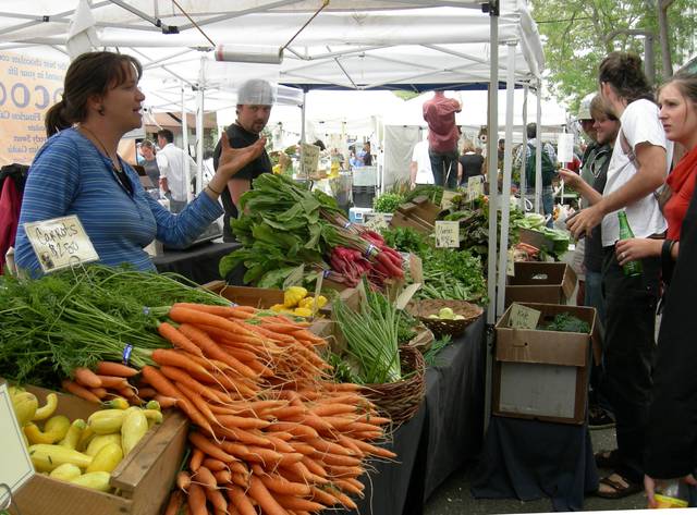 Fresh produce at a farmers' market in Ballard. In the summer, Seattle has over a dozen weekly farmers' markets; Sunday in Ballard and Saturday in the University District are among the few year-round markets.