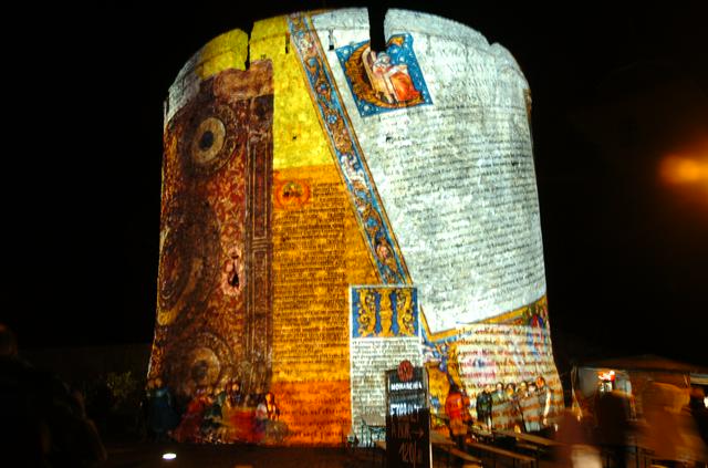 Colourful lights on the walls of the Barbican of Pécs during Sétatér festival in September.