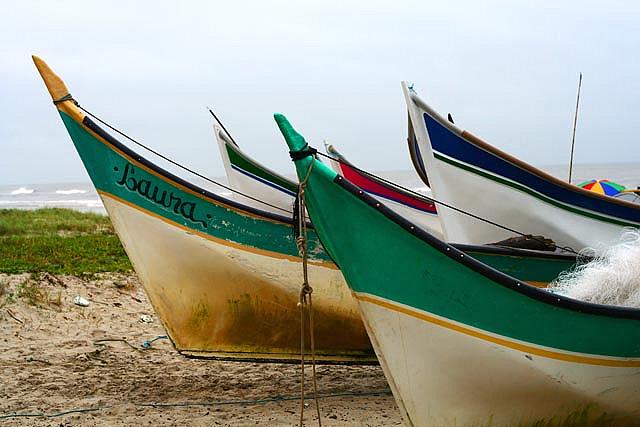 Fishing boats for rent on a beach in Matinhos