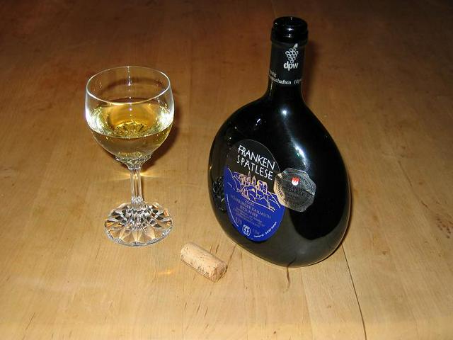 Have a sip of white dry Franconian wine from a Bocksbeutel.