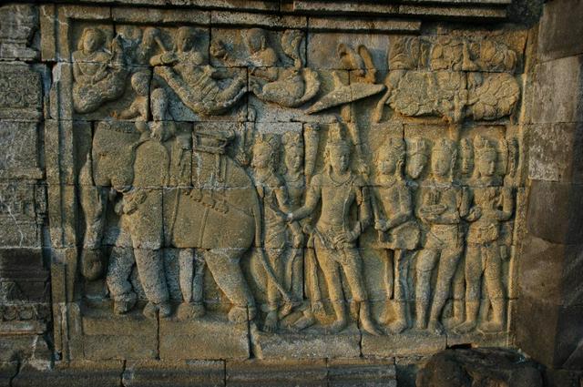 Carved reliefs in Borobudur's lower terraces