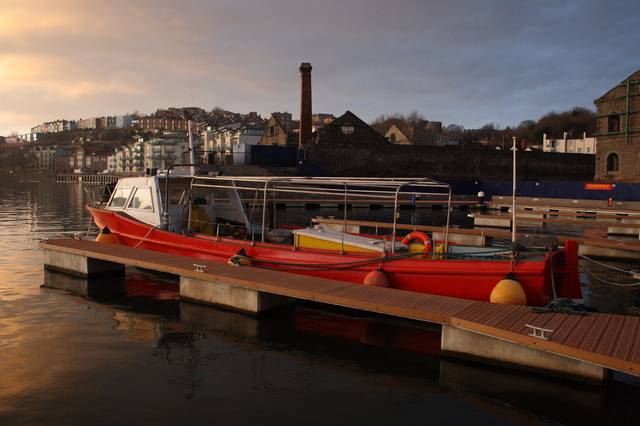 A boat in the sunset at Bristol Harbourside