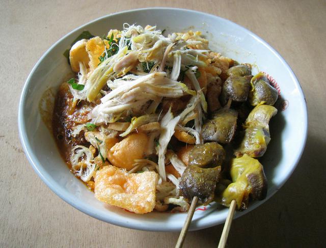 Bubur Cianjur; chicken rice congee with chicken liver and gizzard satay.