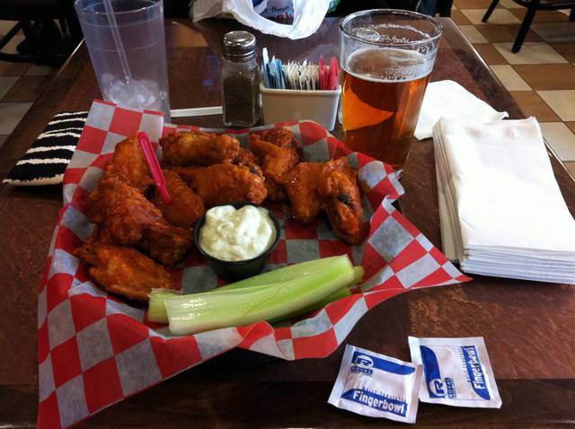 The canonical Buffalo wings: wings, celery, blue cheese, beer, and moist towelettes.