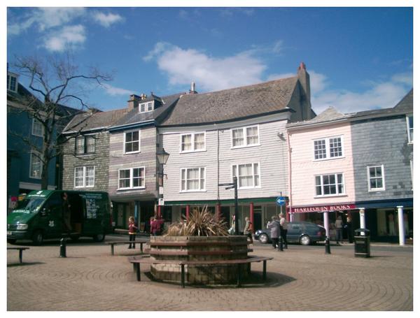 Market square, with the Butterwalk across High street in the background.There is a market every Friday and Saturday, an Elizabethan market on Tuesdays (with the sellers dressed in period costume) and a monthly gourmet food market.