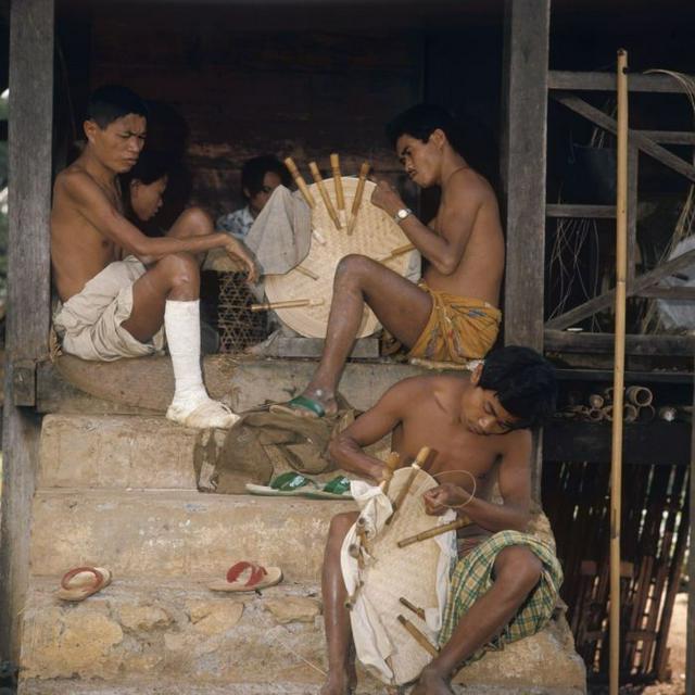 Leper patients near Rantepao plaiting hats