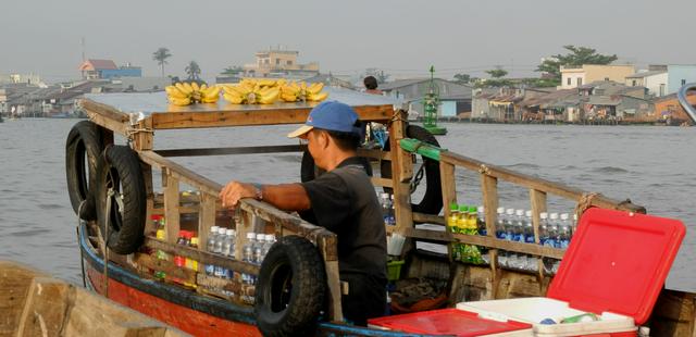 Vegetable and fruit vendor at the Floating Market