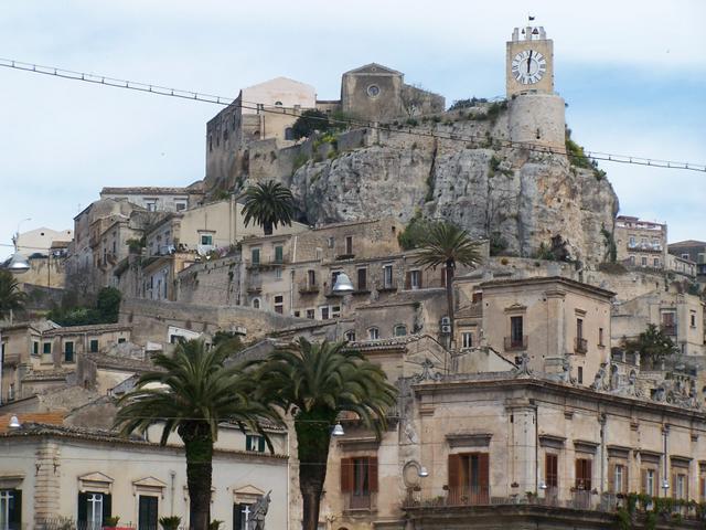 Castello di Modica with a clock tower