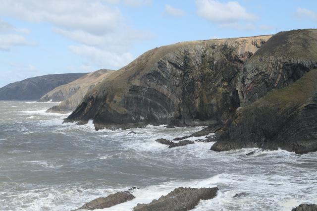 The cliffs from Ceibwr Bay, North Pembrokeshire, showing the dramatic bending of the rock strata.