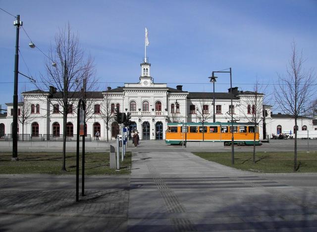 The central railway station and one of the famous orange trams