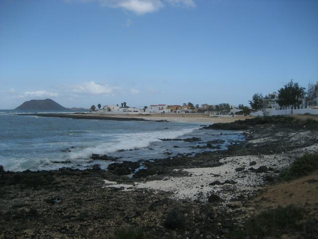  Northwestern rockier beaches of Corralejo, with the Isla de los Lobos in the background