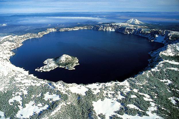 The lake partly fills a nearly 4,000 feet (1,220 m) deep caldera.