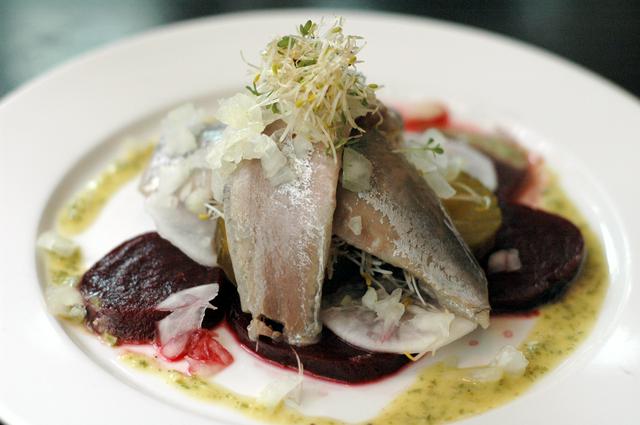 A fancy serve of herring at a restaurant