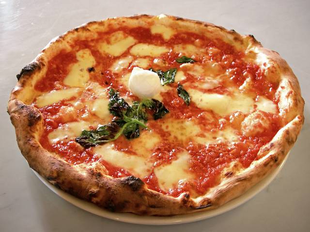 Pizza margherita, topped by a Mozzarella di bufala bocconcino