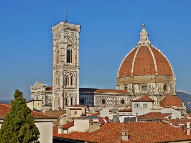 Florence's cathedral; bell tower by Giotto to the left and the tower of the Palazzo Vecchio in front