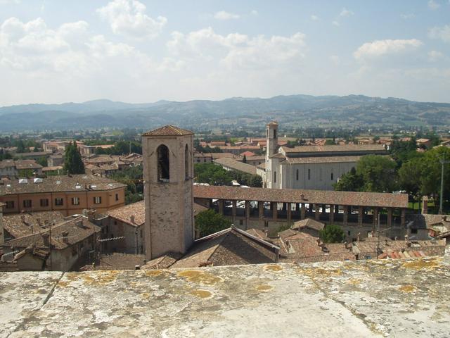 View of city rooftops and surrounding countryside from Piazza Pensile