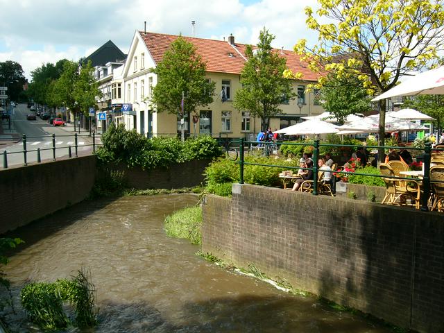 Outdoor café terraces along the Gulp-stream, in the village centre.