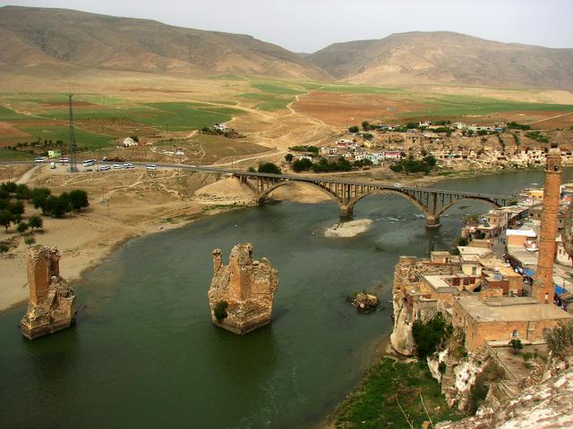 Tigris River as seen from the citadel high above the cliffs, with the ruins of ancient bridge backed by the modern one