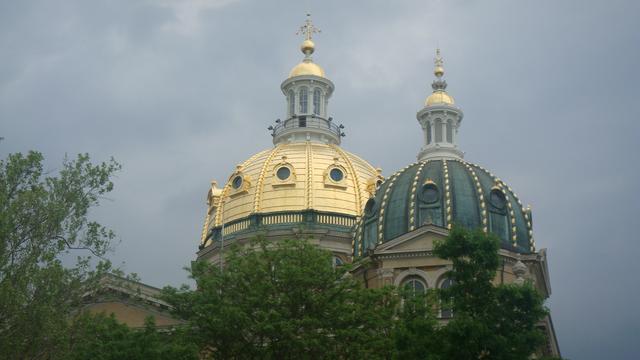 Even on a cloudy day, two of the capitol domes still glisten