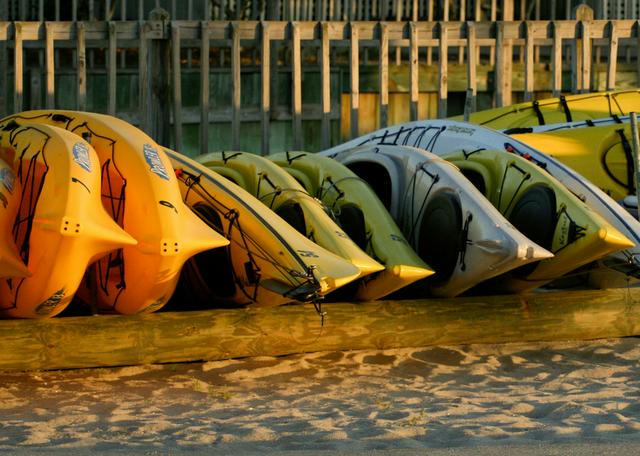 Lonely kayaks longing for the summer to arrive