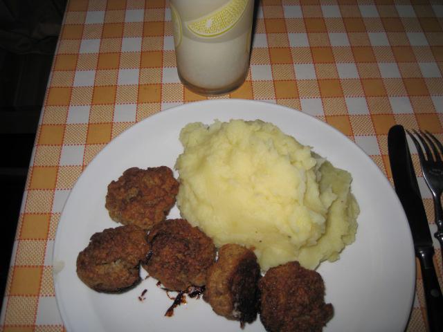 Meatballs with mashed potatoes and a glass of milk
