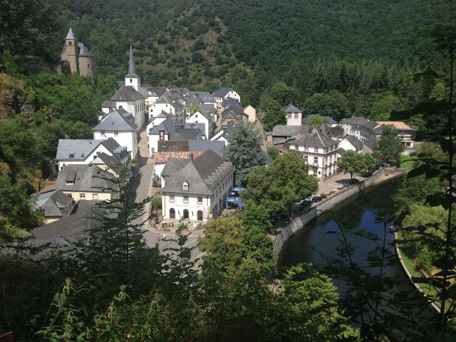 View of the town with part of the castle remains in the background.