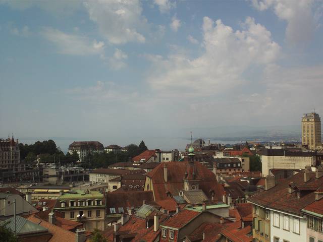 Old town roofs and Lake Geneva as seen from Place de la Cathédral