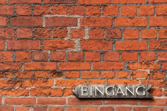 A brick wall with an entrance sign in the Altstadt