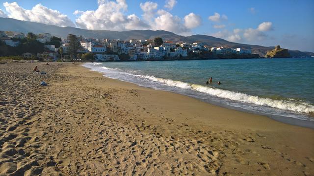 Photograph of the main beach in Andros town, looking back at Andros