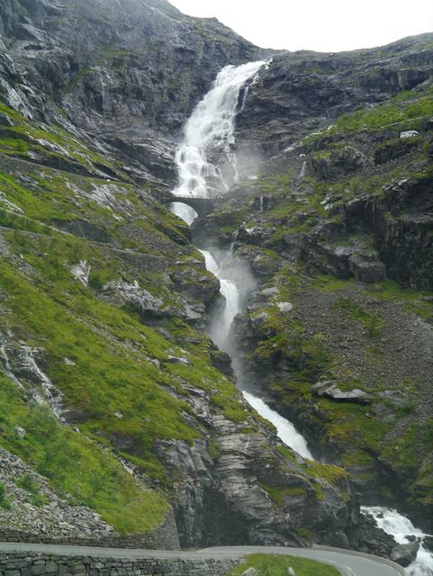 Trollstigen mountain pass and hairpin road with waterfall