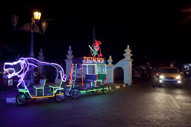 At night, the 'alun-alun' is ablaze with the lights of decorated chariots