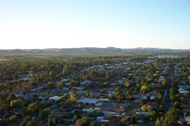 Nuriootpa, Barossa Valley. The town is in the foreground, followed by vineyards, Barossa Ranges in the background.