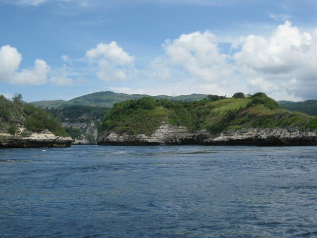 The rugged beauty of the south coast of Nusa Penida; the high point in the far background is Puncak Mundi