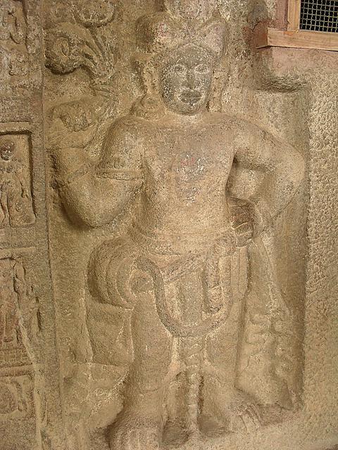 A close up of a figure from the Buddhist canon