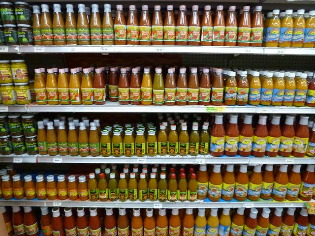 Pepper sauces, pepper sauces and more pepper sauces in a supermarket