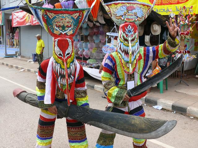 Traditional Phitakon masks worn at the Phitakon Festival. Note the handle of the sword.