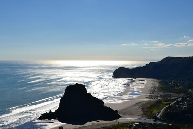 Lion Rock (centre) and Piha Beach