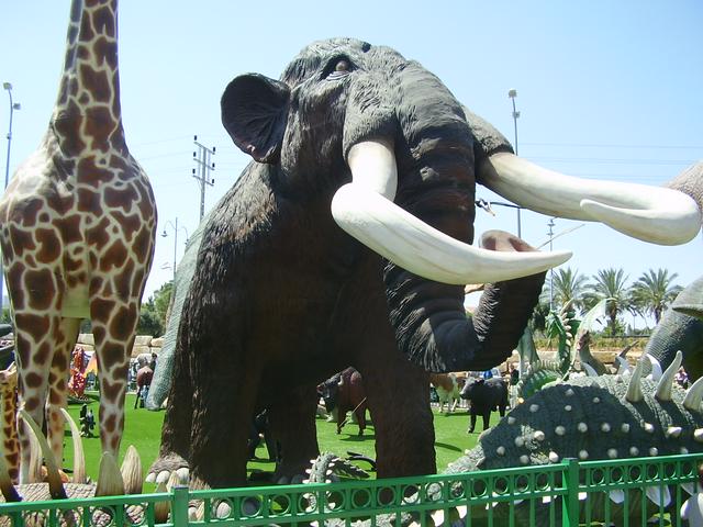 Sculptures of mammoth and other creatures at the entrance to Cinema City