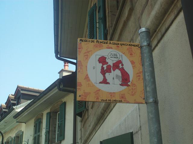 Street sign in Geneva asking partygoers to keep their voices down at night