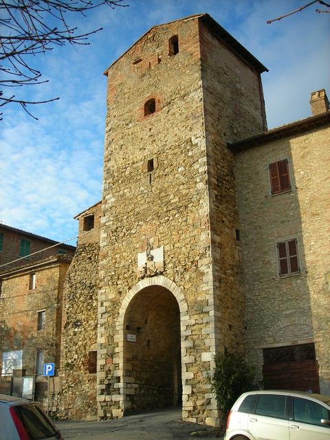 alt= The main gate of Compignano