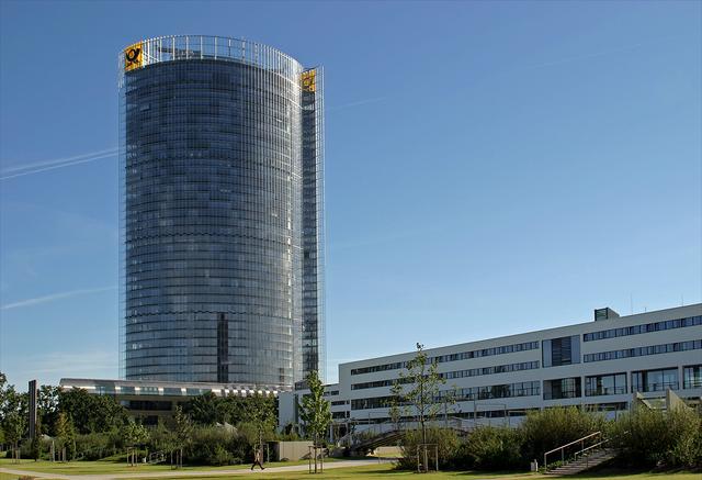 Schürmann-Bau, envisaged as the seat of the (West) German parliament and now serving as the headquarters of the Deutsche Welle, extending flat next to the tall tower of Deutsche Post