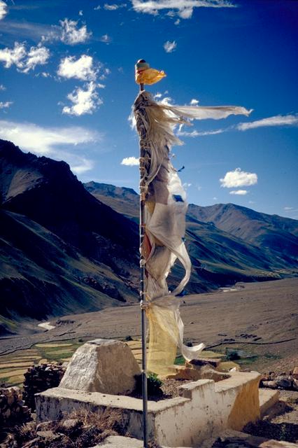 Prayer flag above the monastery of Tanze (the wind is believed to propagate the prayers printed on tissue)