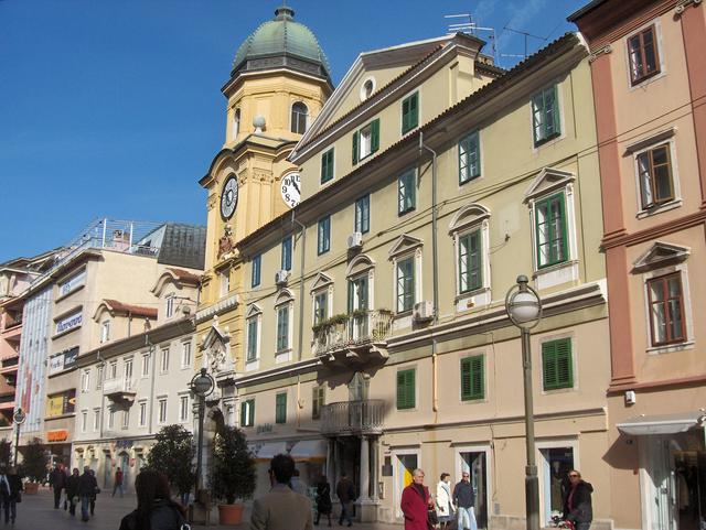 Yellow cock on city tower and palace Wohinz on Korzo street