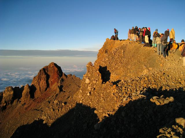 Sunrise over the climbers at the summit of Gunung Rinjani